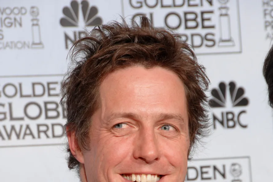 Hugh Grant Says His Iconic ‘Love Actually’ Dancing Scene Was “The Most Excruciating Scene Ever”